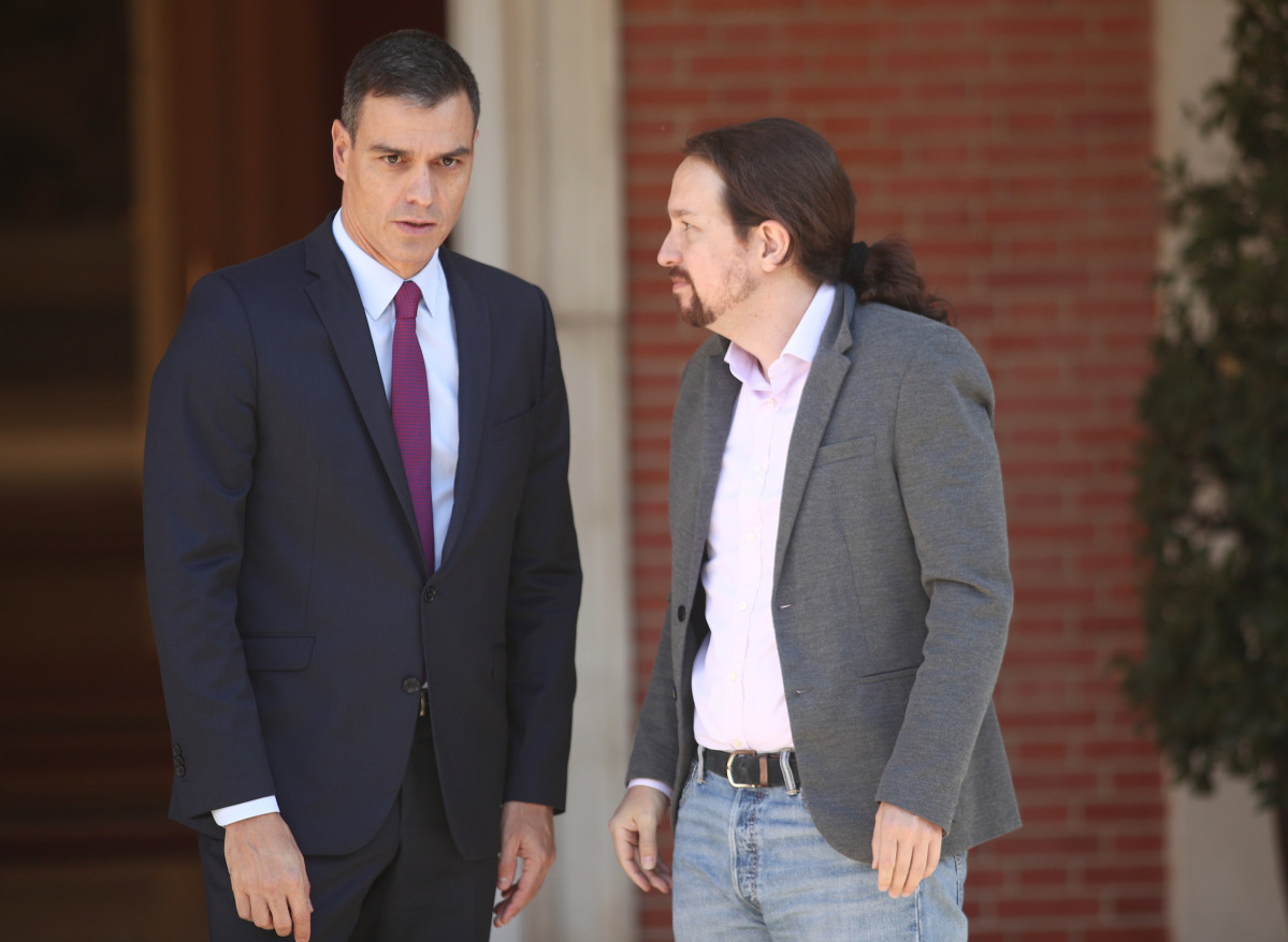 Pedro Sánchez con Pablo Iglesias tras los incidentes violentos en Barcelona