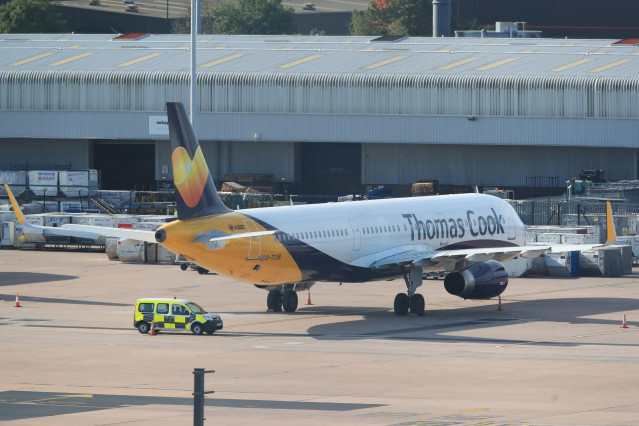 23 September 2019, England, Manchester: An Airbus A321 from the airline Condor with the design of the tourism company Thomas Cook stands on the tarmac at  Manchester Airport. Thomas Cook, one of Britain's biggest travel firms, filed for liquidation early