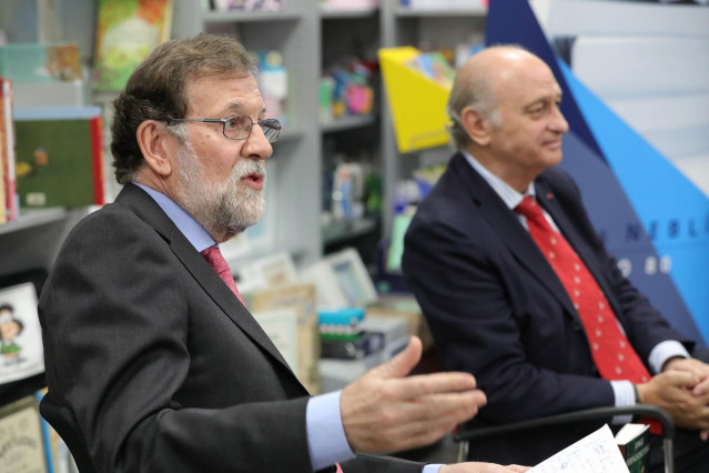 El expresidente del Gobierno Mariano Rajoy, y el exministro de Interior y miembro del PP, Jorge Fernández Díaz