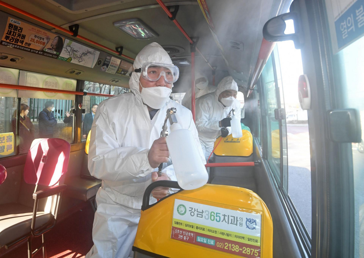 30 January 2020, South Korea, Seoul: Quarantine officials disinfect a bus at a bus stop in eastern Seoul amid growing fears over the spread of a deadly new coronavirus. Photo: -/YNA/dpa