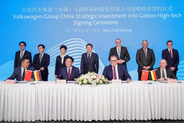 Imagen de la firma del acuerdo en China.