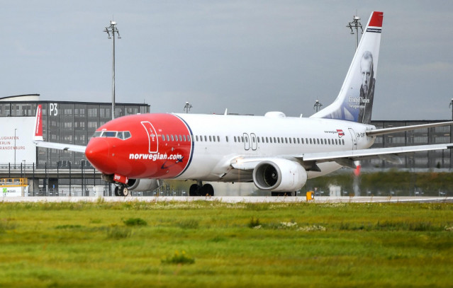 FILED - 12 September 2017, Brandenburg, Schoenefeld: A passenger aircraft of the Norwegian airline Norwegian Air takes off from Berlin Brandenburg Airport Willy Brandt (BER). Grounding the Boeing 737 MAX 8 jets in its fleet because of safety worries contr