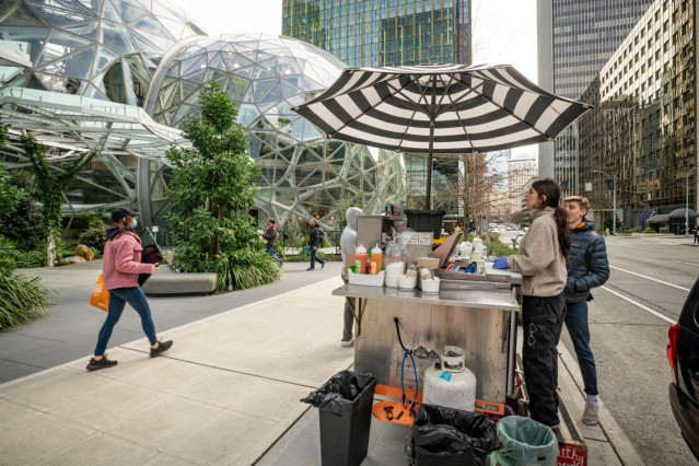 March 5, 2020 - Seattle, Washington, United States: The usual crowds of Amazon workers were nowhere to be seen during lunch today at Amazon's Seattle campus. Here Kim Garcia (right) of 