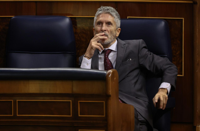 Archivo - El ministro de Interior, Fernando Grande-Marlaska, durante una sesión plenaria en el Congreso de los Diputados.