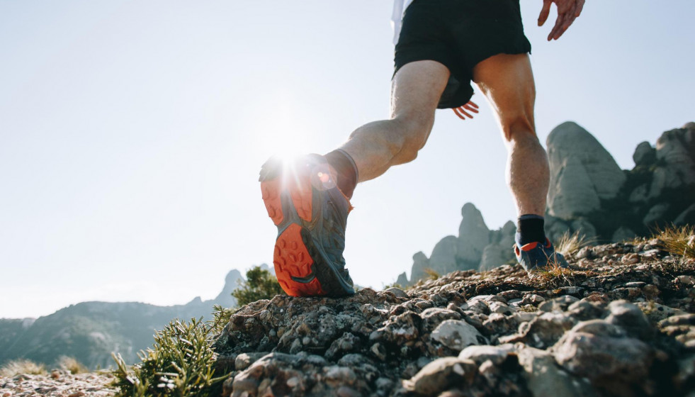 Cool man with tattoos ultra trail runner