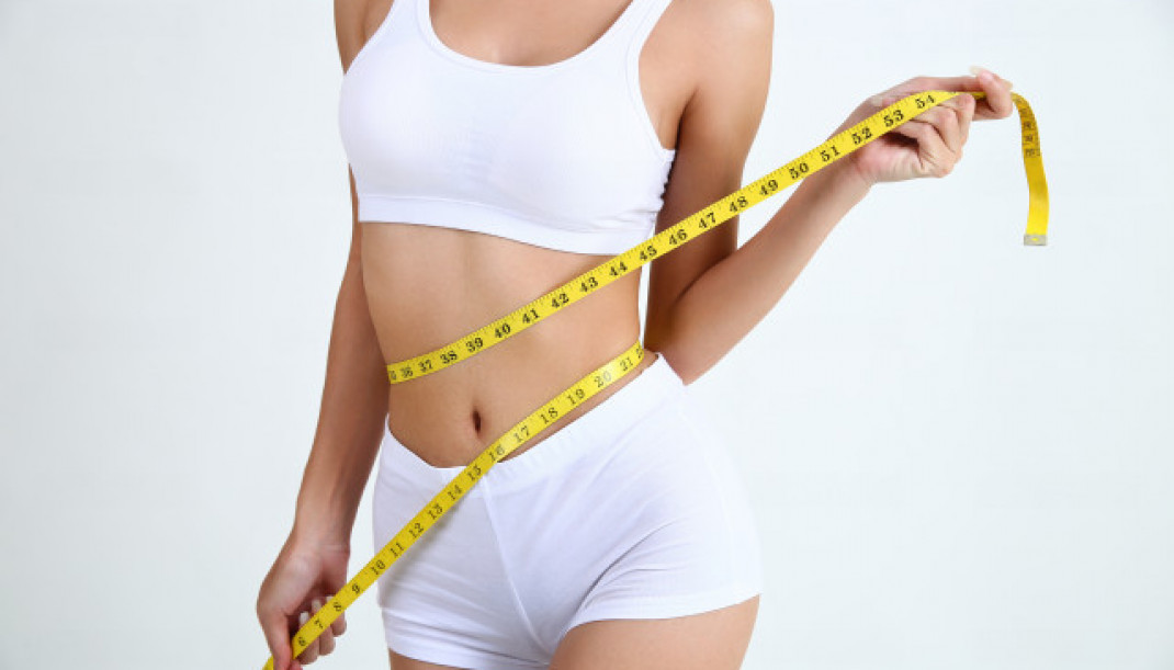 Youngwomanwithbeautifulbodymeasuretape